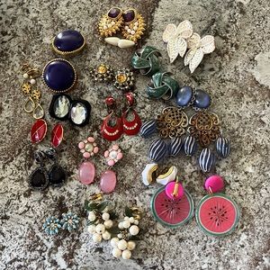 16 pairs of clip on earrings.